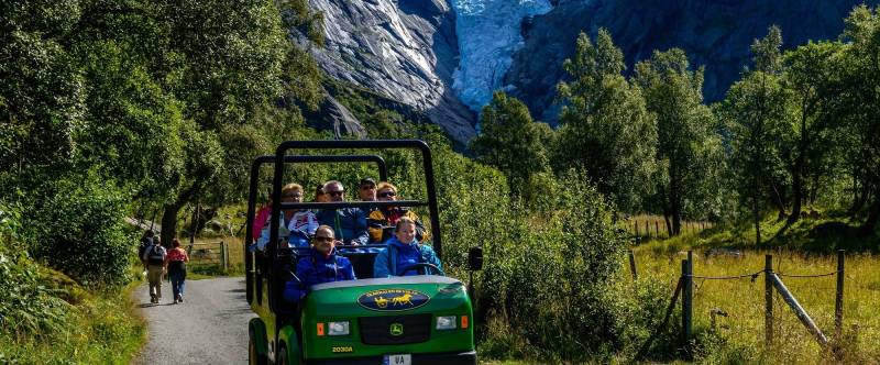 Tourist in a open car in a natural park